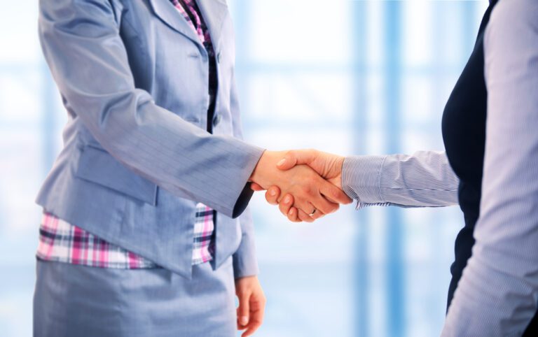 women shaking hands